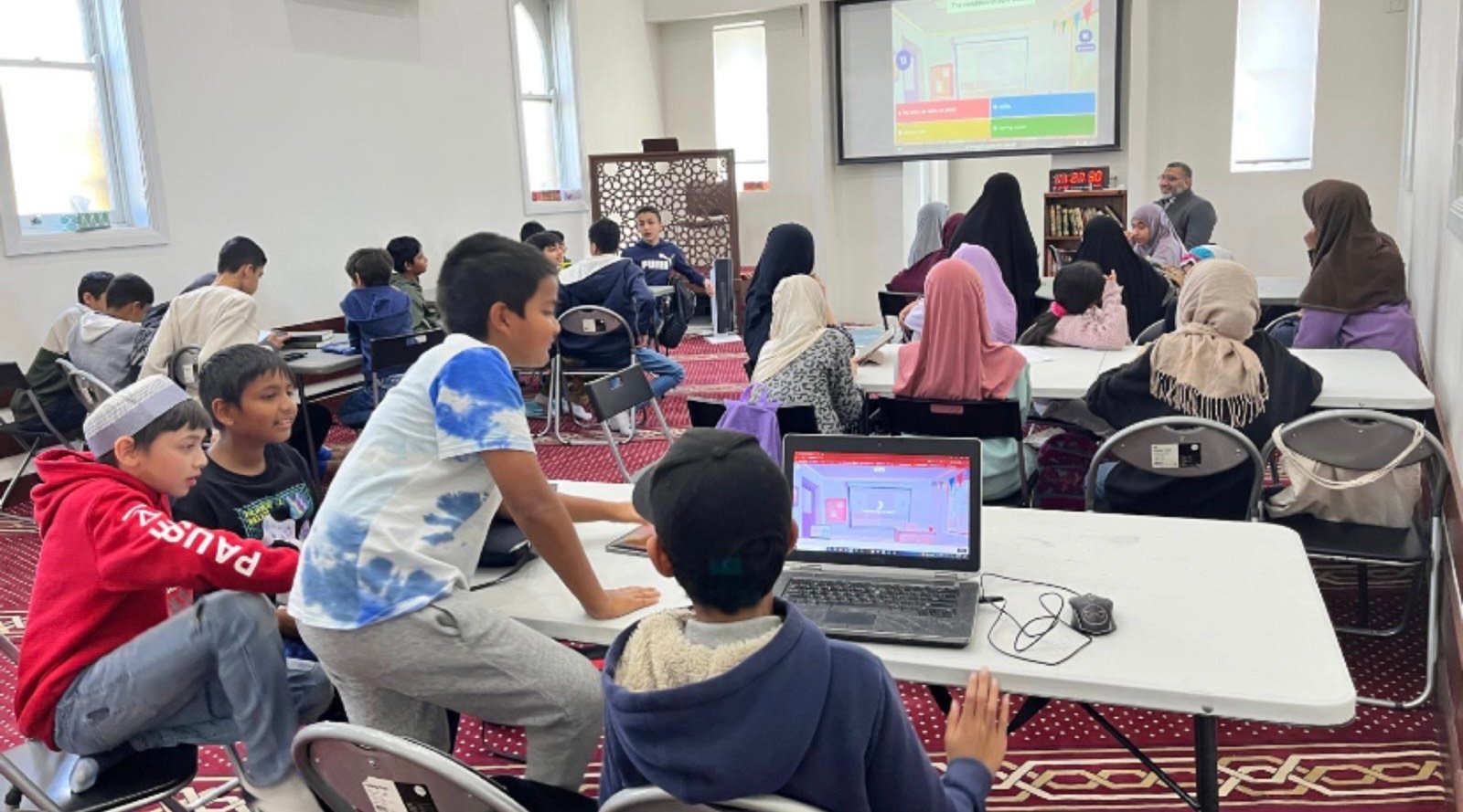 Children reading and writing Arabic during a Sunday class